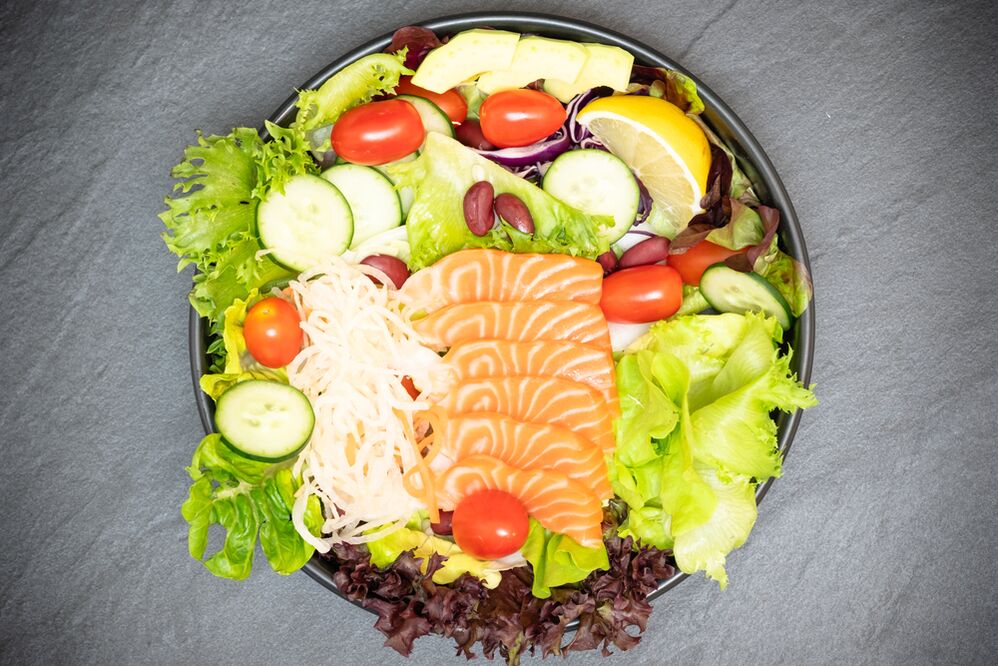 Delicious salad with salmon on the menu with proper nutrition for weight loss